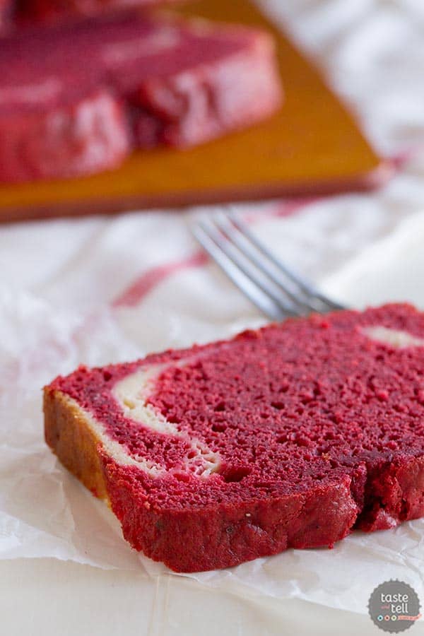 A red velvet quick bread with a cream cheese filling on www.tasteandtellblog.com