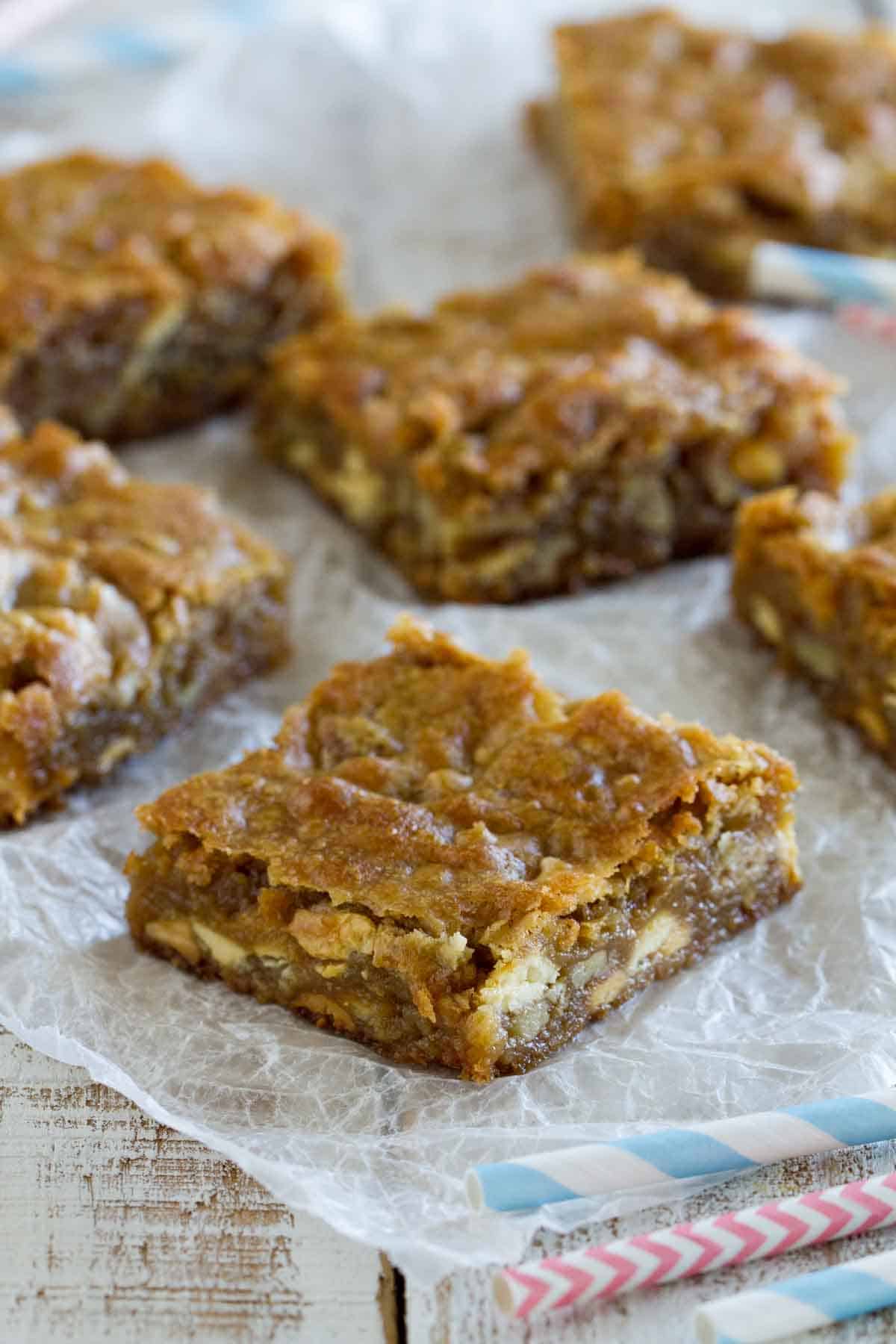 blondies on a crumpled sheet of parchment paper