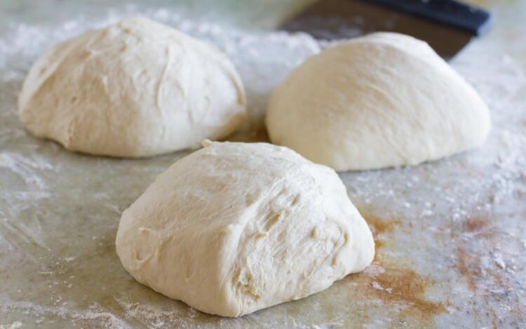 three balls of pizza dough