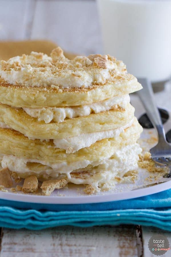 Pancakes for dessert!! These fluffy Cheesecake Pancakes are topped with a cream cheese frosting and graham cracker crumbs for a fun and delicious treat.