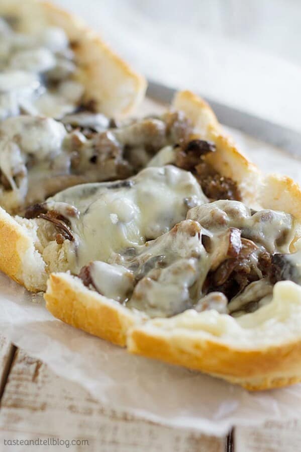 French bread is topped with cooked sausage, portobello mushrooms and cheese in this easy French bread pizza recipe.