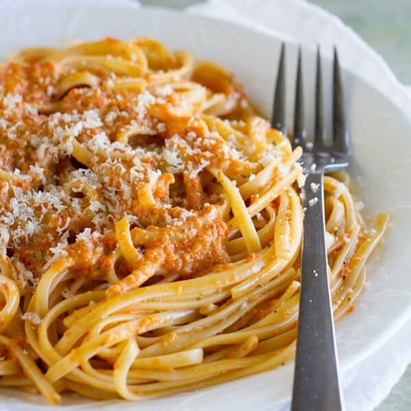 A roasted red pepper pesto is the star in this easy vegetarian pasta dinner. This Roasted Red Pepper Pesto Linguine is easy enough for a weeknight, but fancy enough for a special dinner.
