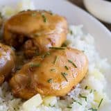 Boneless chicken thighs are coated in a sweet asian-inspired sauce and served over sweet pineapple rice in this Sweet Asian Chicken with Pineapple Rice.