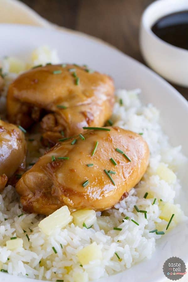 Boneless chicken thighs are coated in a sweet asian-inspired sauce and served over sweet pineapple rice in this Sweet Asian Chicken with Pineapple Rice.