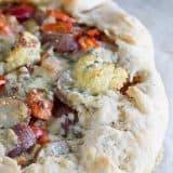 A great way to clear out the vegetable bin in your refrigerator, this Crostata with Oven Roasted Vegetables is a filling vegetarian recipe that is packed with flavor.