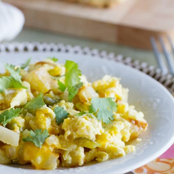 The perfect breakfast for dinner recipe, this Poblano Chile Scramble has eggs and potatoes cooked with freshly roasted chiles. A great taste of the southwest!