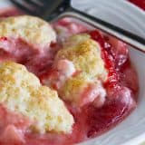 Bowl filled with Strawberry Cobbler with Cream Cheese.