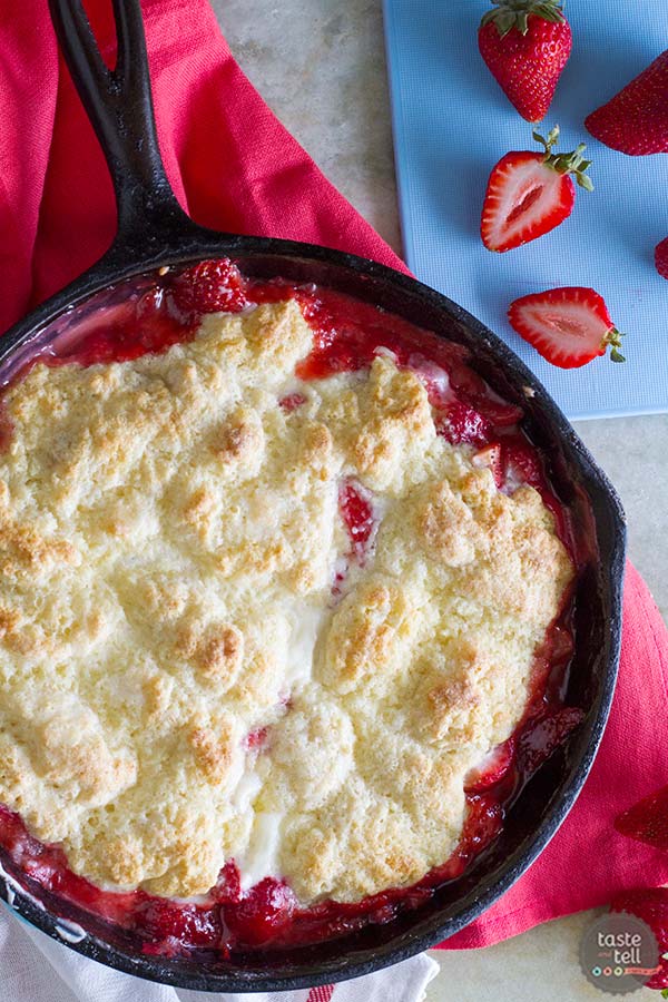 Strawberry Cobbler with a creamy center in a cast iron skillet.