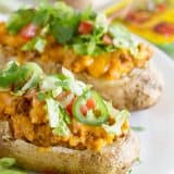 Break away from your normal Taco Tuesday with these Taco Stuffed Potatoes - twice baked potatoes with a southwestern twist!