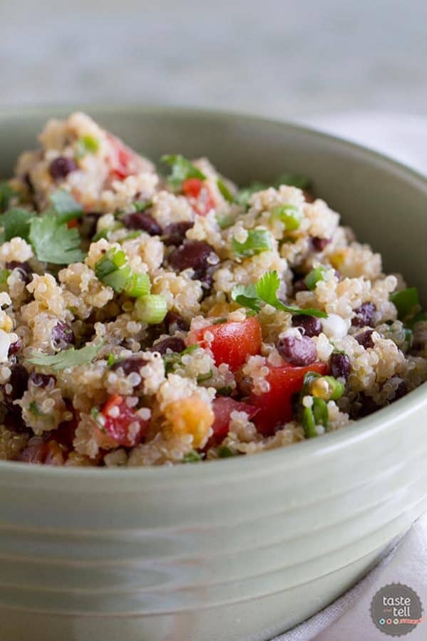 Healthy and satisfying, this Tomato and Black Bean Quinoa Salad is perfect for a pot luck or for a delicious side dish.