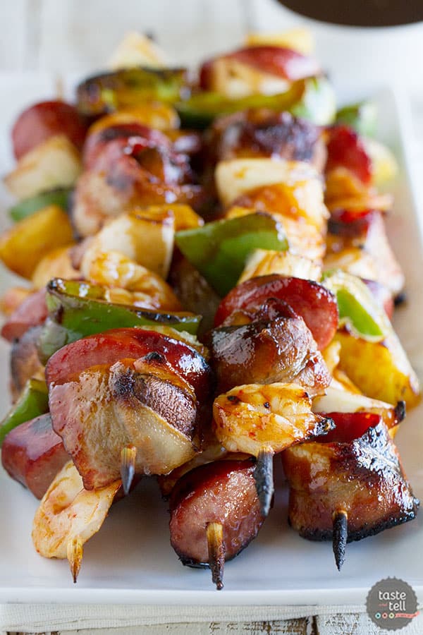 Heat that grill up for these Grilled Shrimp and Sausage Kabobs - with lots of veggies, sausage, shrimp and bacon, all covered in a sticky sweet glaze.