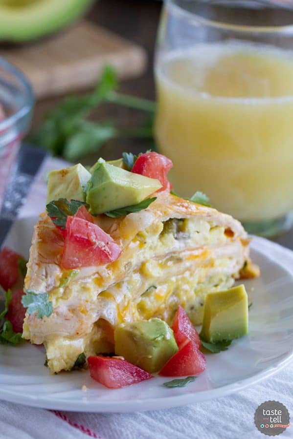 This Breakfast Tortilla Stack has flour tortillas that are layered with scrambled eggs with green chiles, a sour cream sauce and cheese for a breakfast dish that is perfect for breakfast, lunch or dinner!