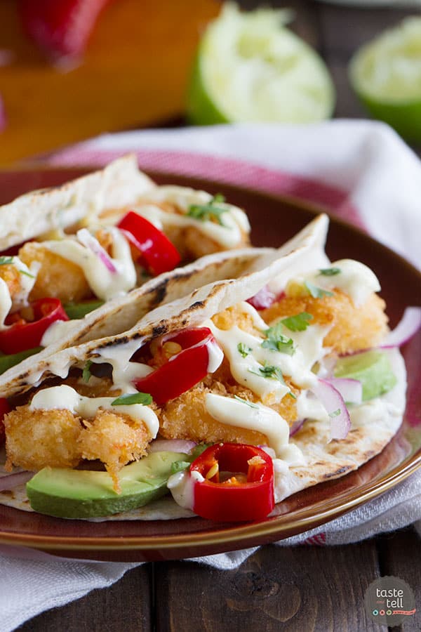 Crispy fried shrimp are combined with your favorite taco toppings and a homemade mayonnaise in this Crispy Shrimp Taco Recipe that is perfect for Taco Tuesday.