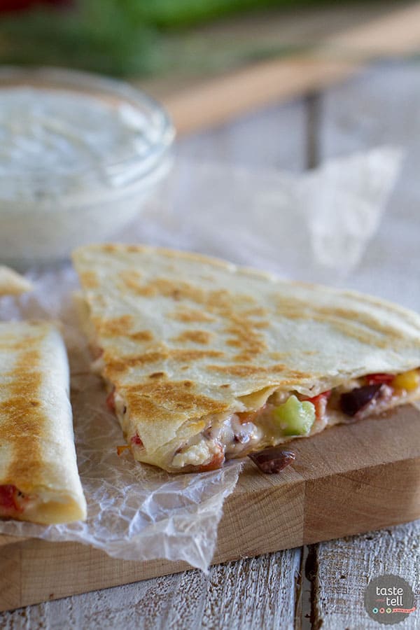 Greek quesadilla on a cutting board.