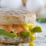 Perfect for breakfast, lunch or dinner, this Sausage and Egg Breakfast Sandwich Recipe has a homemade sausage patty and a perfectly cooked egg, and then is topped with an easy Sriracha Cilantro Mayonnaise.