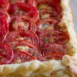 Perfect as a light supper or as a side dish, this Tomato Tart with Bacon and Gruyere is as tasty as it is beautiful!