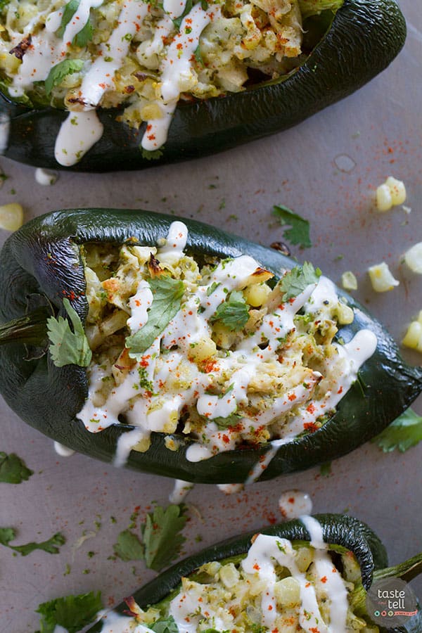 Flavor explosion! These Chicken and Corn Stuffed Chiles are packed with flavor - chicken, corn, cheese and salsa all inside a mild poblano pepper. Don’t skip the lime cream!