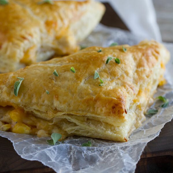 Chicken, corn, cheese and an easy cream sauce are enclosed in puff pastry triangles to make this Creamy Chicken and Corn Turnover Recipe that will be a hit with the family.