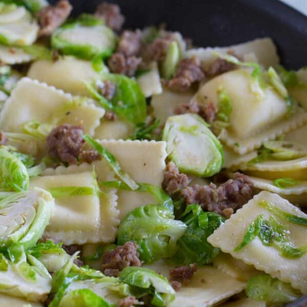 Looking for an easy, fast, dinner with less than 10 ingredient? This Easy Ravioli with Sausage and Brussels Sprouts comes together in well under 30 minutes and is delicious and filling.