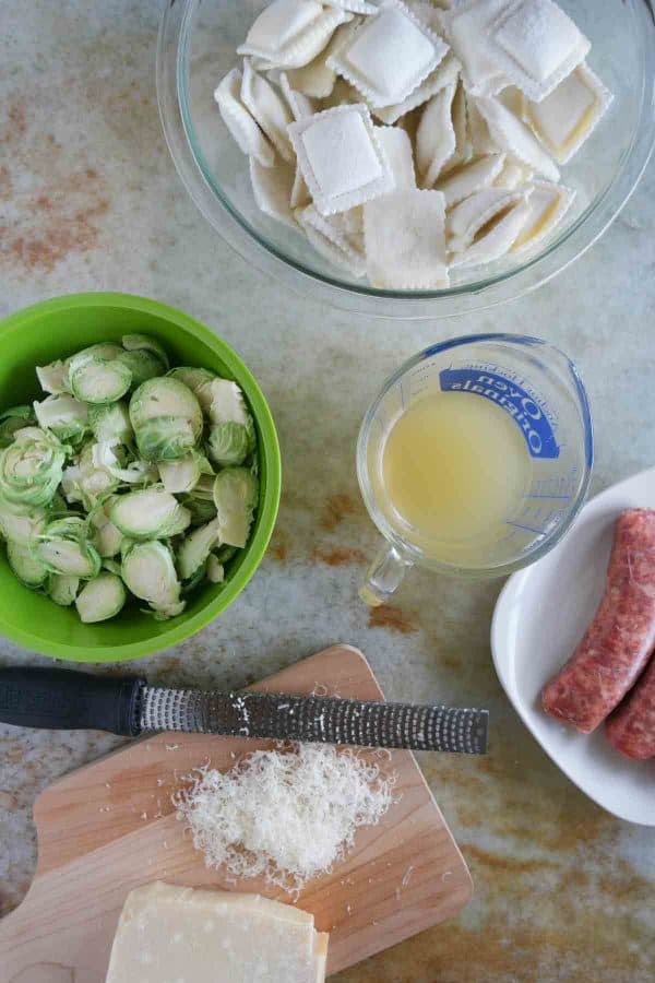 Looking for an easy, fast, dinner with less than 10 ingredient? This Easy Ravioli with Sausage and Brussels Sprouts comes together in well under 30 minutes and is delicious and filling.