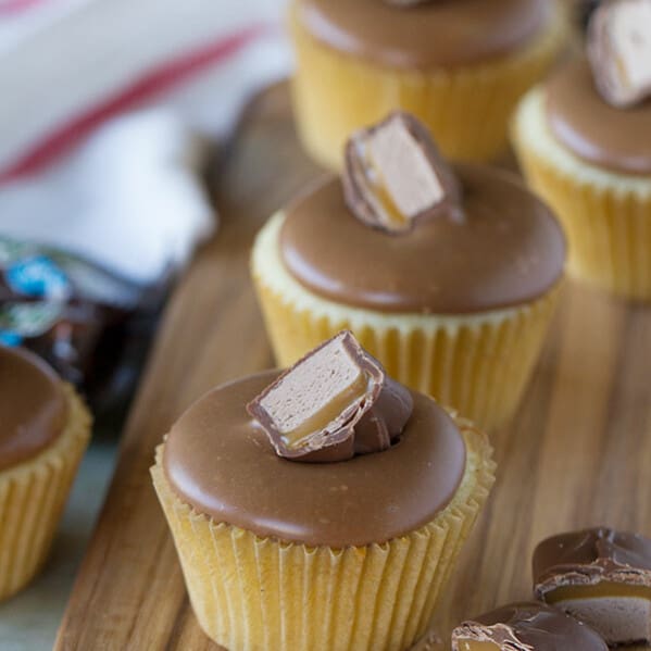 A frosting made from candy bars! These simple yellow cupcakes are topped with a sweet and smooth Milky Way Bar frosting. Candy bar lovers will love these Milky Way Bar Cupcakes!