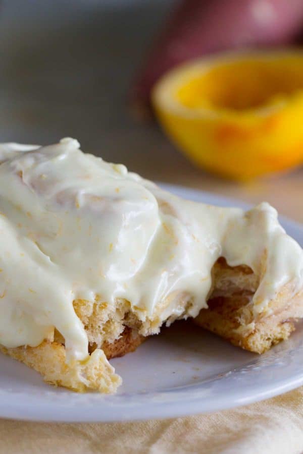 Mashed sweet potatoes make these rolls super tender and soft and the orange cream cheese glaze takes these Sweet Potato Cinnamon Rolls with Orange Cream Cheese Frosting to a new level!