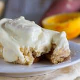 Mashed sweet potatoes make these rolls super tender and soft and the orange cream cheese glaze takes these Sweet Potato Cinnamon Rolls with Orange Cream Cheese Frosting to a new level!