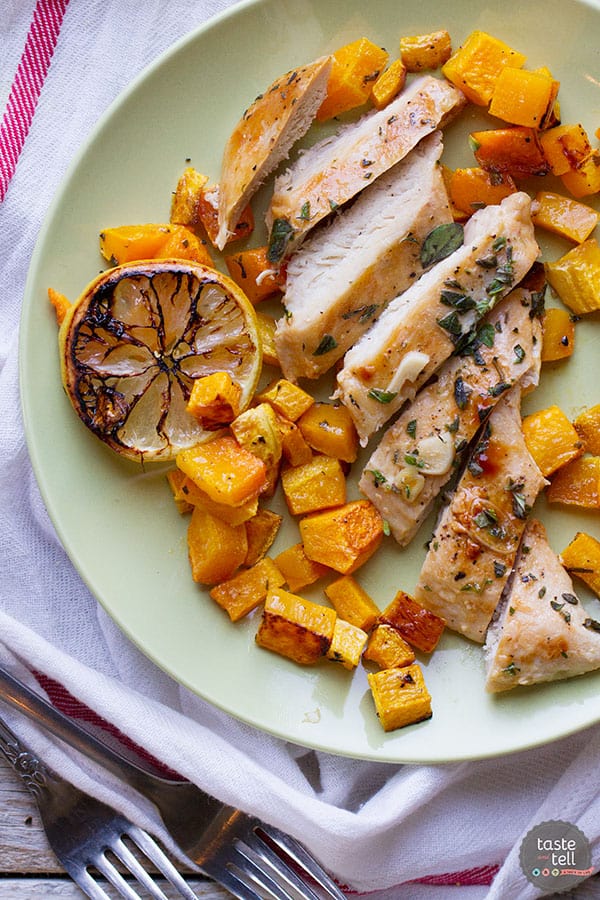Simple and healthy, this Easy Lemon Chicken with Butternut Squash serves up roasted chicken breasts doused in lemon juice over roasted butternut squash.