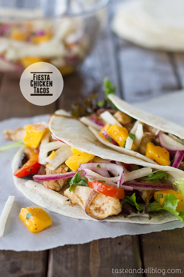 Chicken tacos are topped with a sweet and crunchy mango and jicama salad in these Fiesta Chicken Tacos with Mango and Jicama Salad.