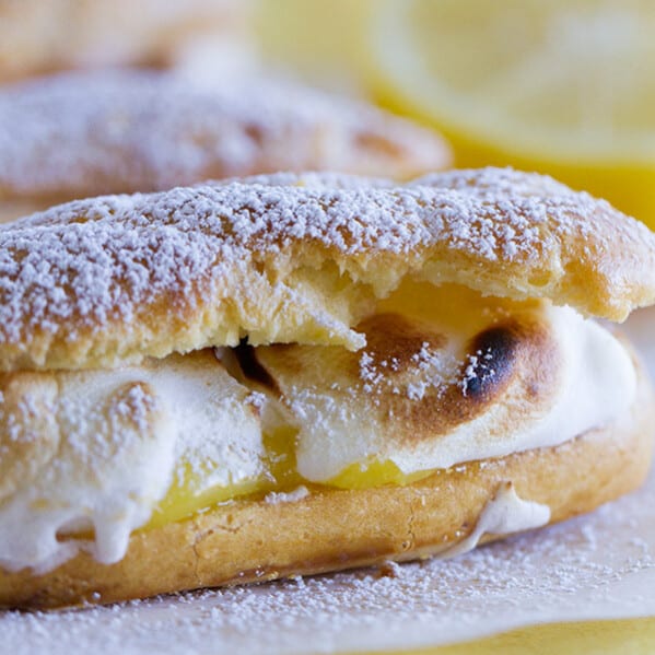 Lemon meringue lovers will go crazy for these Lemon Meringue Eclairs - pate a choux eclair shells filled with lemon curd and then topped with toasted meringue.