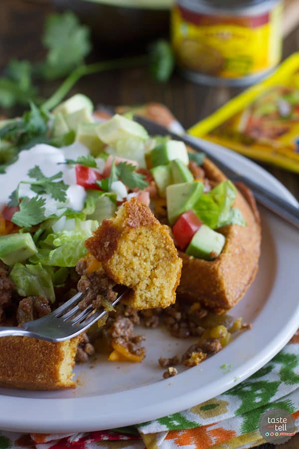 Waffles are not just for breakfast! These savory Taco Cornbread Waffles are topped with ground beef taco mixture and all of your favorite taco toppings. This is a great way to change up taco night!
