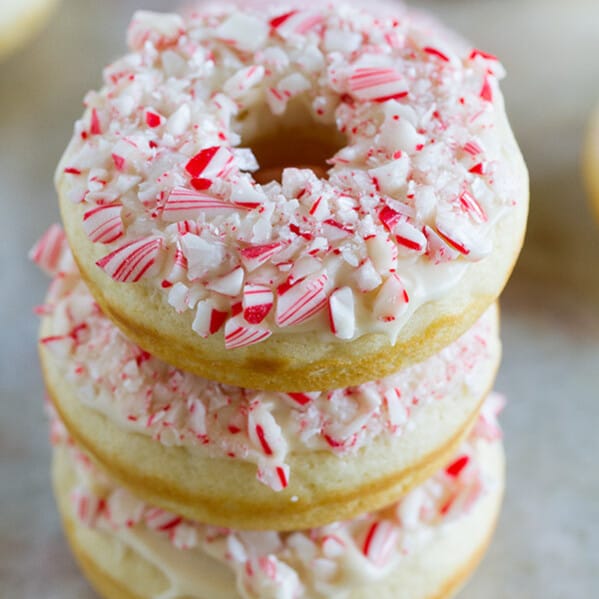 The perfect holiday treat, these Baked Peppermint Donuts are not only topped with crushed candy canes, but the donuts are lightly flavored with peppermint.