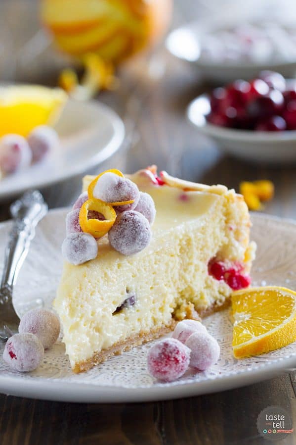 Slice of cranberry orange cheesecake on a plate.