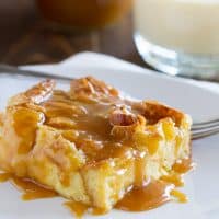 Transform your eggnog into this Eggnog Croissant Bread Pudding with Caramel Eggnog Syrup. Great for a decadent breakfast, or as a special dessert, this bread pudding is melt in your mouth delicious!