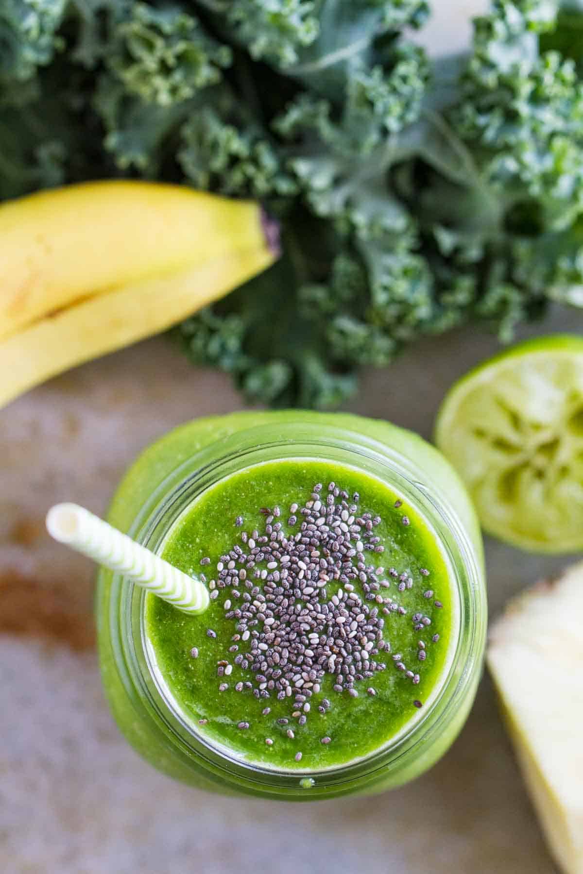 overhead view of green smoothie with chia seeds on top