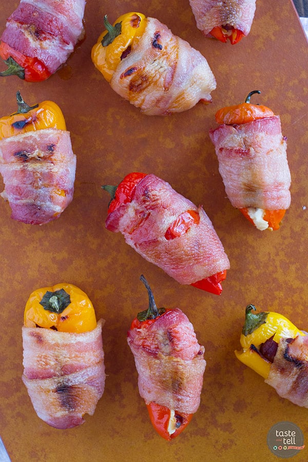 These Sausage Stuffed Peppers have mini peppers that are stuffed with cream cheese and mini smoked sausages, and then are wrapped in bacon for a bite-sized appetizer that will be a total crowd pleaser.