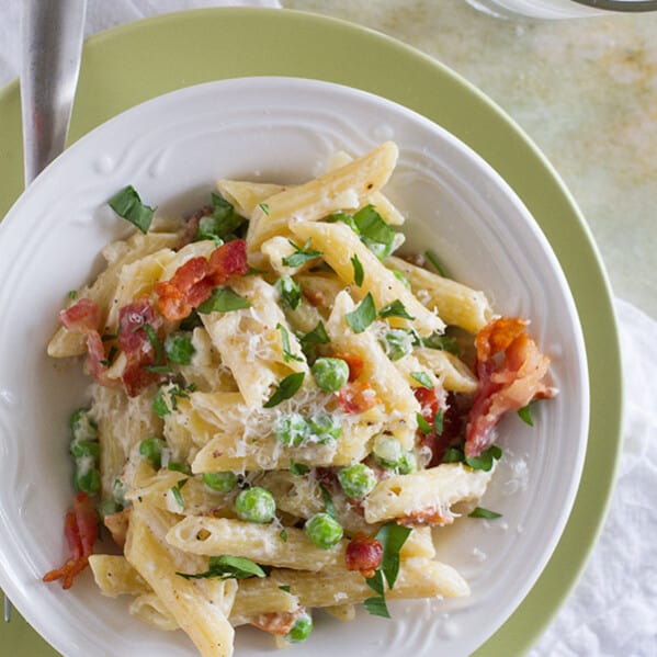 You can’t beat a one pan dinner that is one the table in no time! This One Pan Pasta with Peas and Bacon is easy and flavorful and a pasta dinner that is sure to go on repeat in our house!