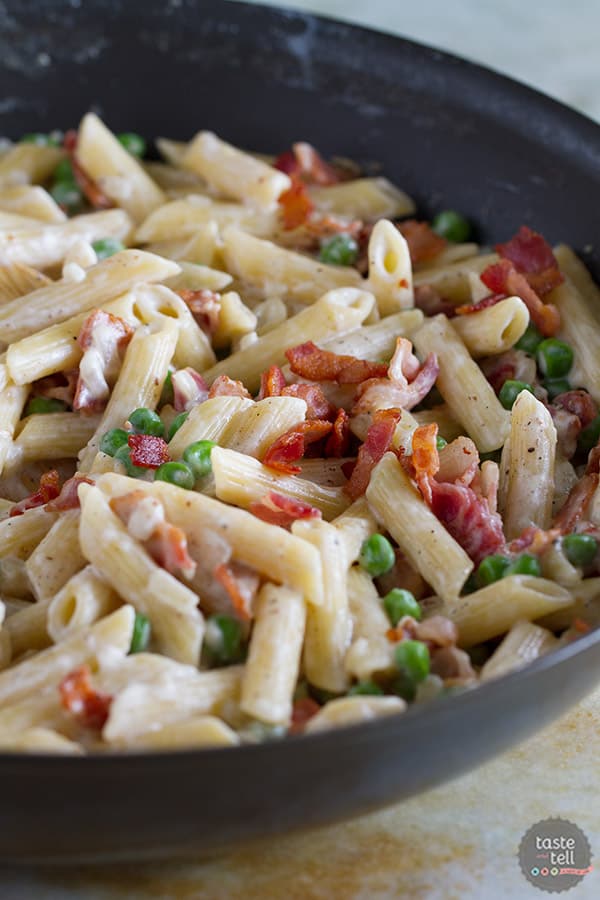 You can’t beat a one pan dinner that is one the table in no time! This One Pan Pasta with Peas and Bacon is easy and flavorful and a pasta dinner that is sure to go on repeat in our house!
