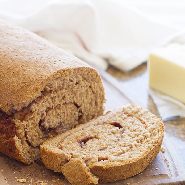 This Whole Wheat Cinnamon Swirl Bread is an easy 100% whole wheat bread, filled with a swirl of cinnamon and sugar. My favorite is to eat a warm slice with a smear of butter!