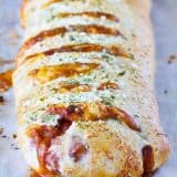 Change up your pizza routine with this Chili Cheese Stromboli! Pizza dough is packed with chili and lots of cheese, then rolled and baked for a fun dinner idea.