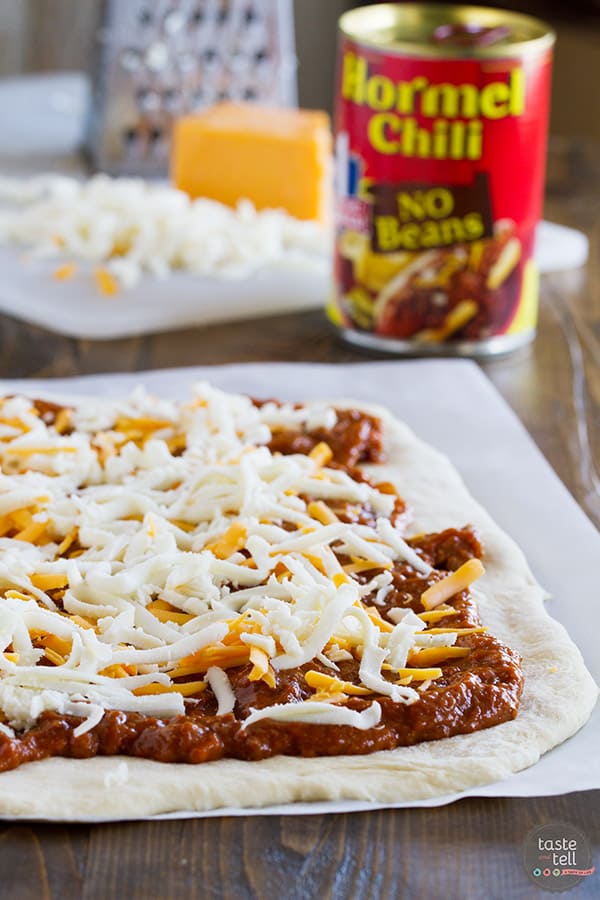 Change up your pizza routine with this Chili Cheese Stromboli! Pizza dough is packed with chili and lots of cheese, then rolled and baked for a fun dinner idea.