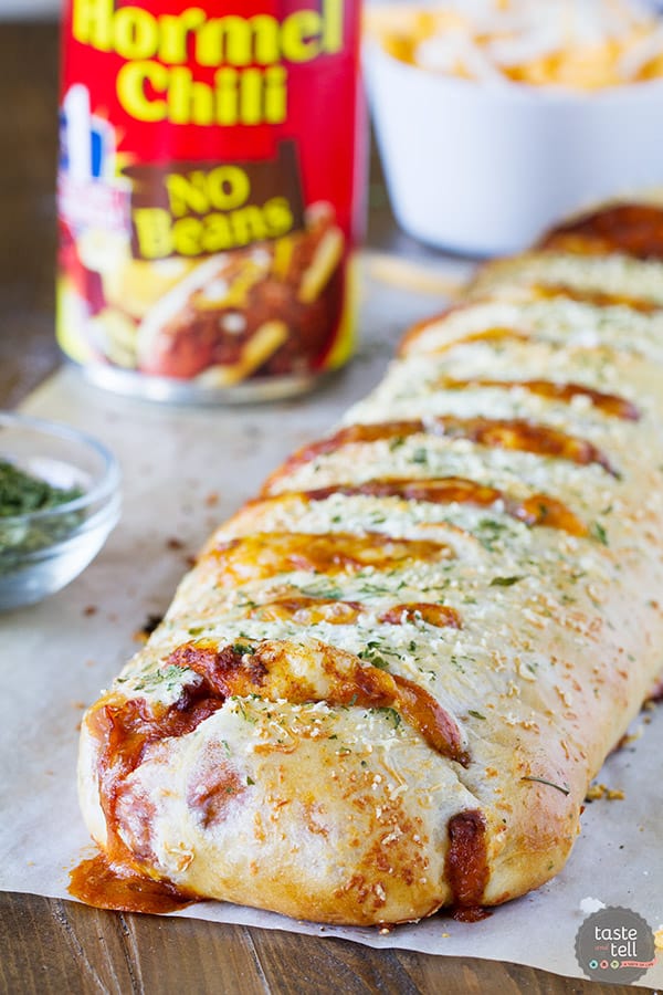 Change up your pizza routine with this Chili Cheese Stromboli! Pizza dough is packed with chili and lots of cheese, then rolled and baked for a fun dinner idea.