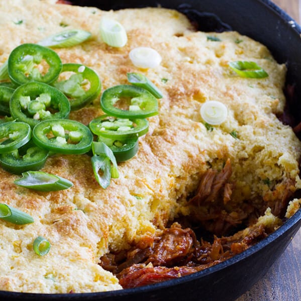 A delicious comfort meal doesn’t have to be difficult! This Cornbread Topped BBQ Pork takes pork that has been slowly cooked in an easy bbq sauce and then tops it with a spicy cornbread.