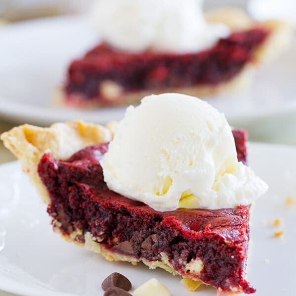 Can’t decide between a pie or a cookie? Get the best of both worlds with this Red Velvet Cookie Pie. This is the perfect holiday pie!