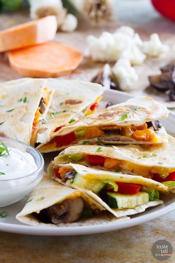 A great way to get your veggies in, these Roasted Veggie Quesadillas are a great way to clean out the veggie drawer to make a lunch or dinner that won’t leave you missing the meat!