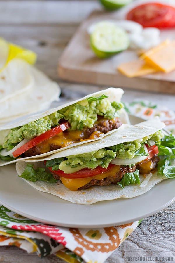 Cheeseburger meets Tex-Mex meets taco night in these taco spiced cheeseburgers that are served taco style.