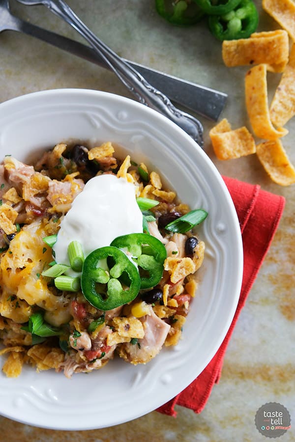 Look no further for an easy slow cooker dinner recipe! This Slow Cooker Cheesy Chicken and Frito Casserole comes together quickly and you can never go wrong when there are Fritos involved!