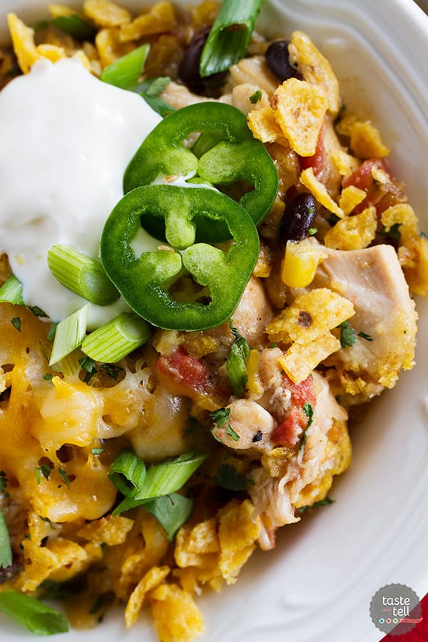 Look no further for an easy slow cooker dinner recipe! This Slow Cooker Cheesy Chicken and Frito Casserole comes together quickly and you can never go wrong when there are Fritos involved!