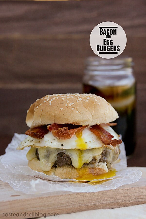 A seasoned burger patty is topped with bacon and eggs for this Bacon and Egg Burger - a burger with a breakfast twist!