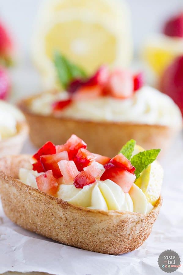 Light and lemony, these Lemon Cream Taco Boats have cinnamon-sugar coated tortilla boats filled with a creamy, luscious lemon cream. Top them off with diced strawberries for a perfect summer treat.